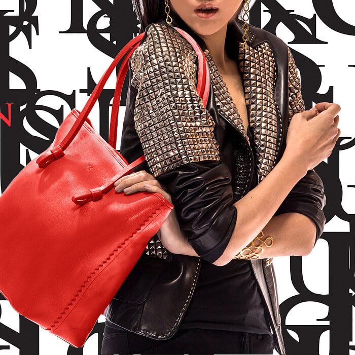 Fashion model holding a red leather tote bag against a graphic Madison City Totes layout.